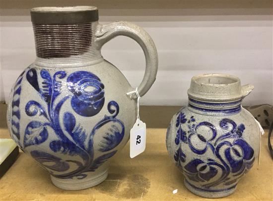 18C German Westerwald stoneware jug of typical design with GR cypher & a similar smaller jug (a.f)